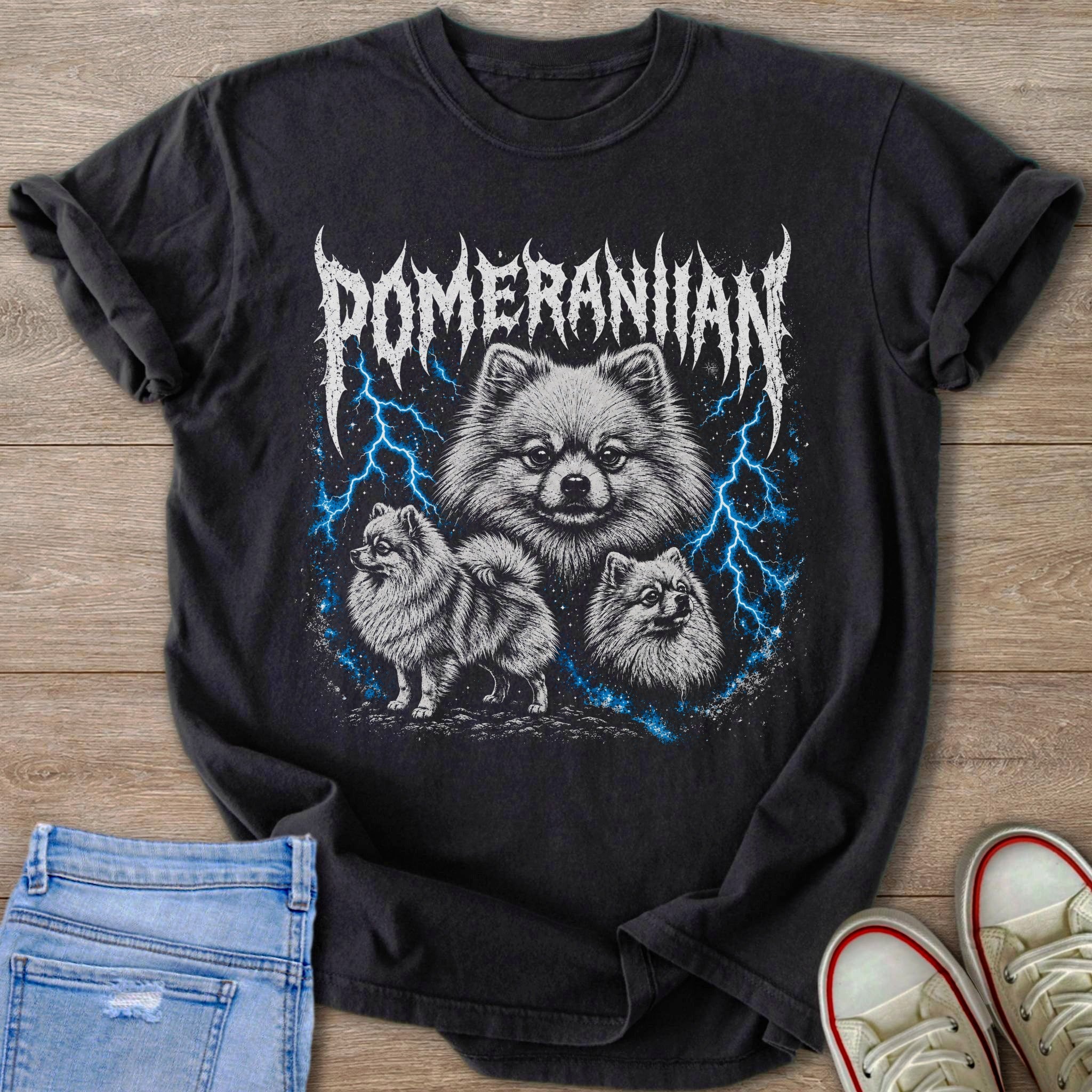 Black t-shirt with three Pomeranians and blue lightning graphic with text.