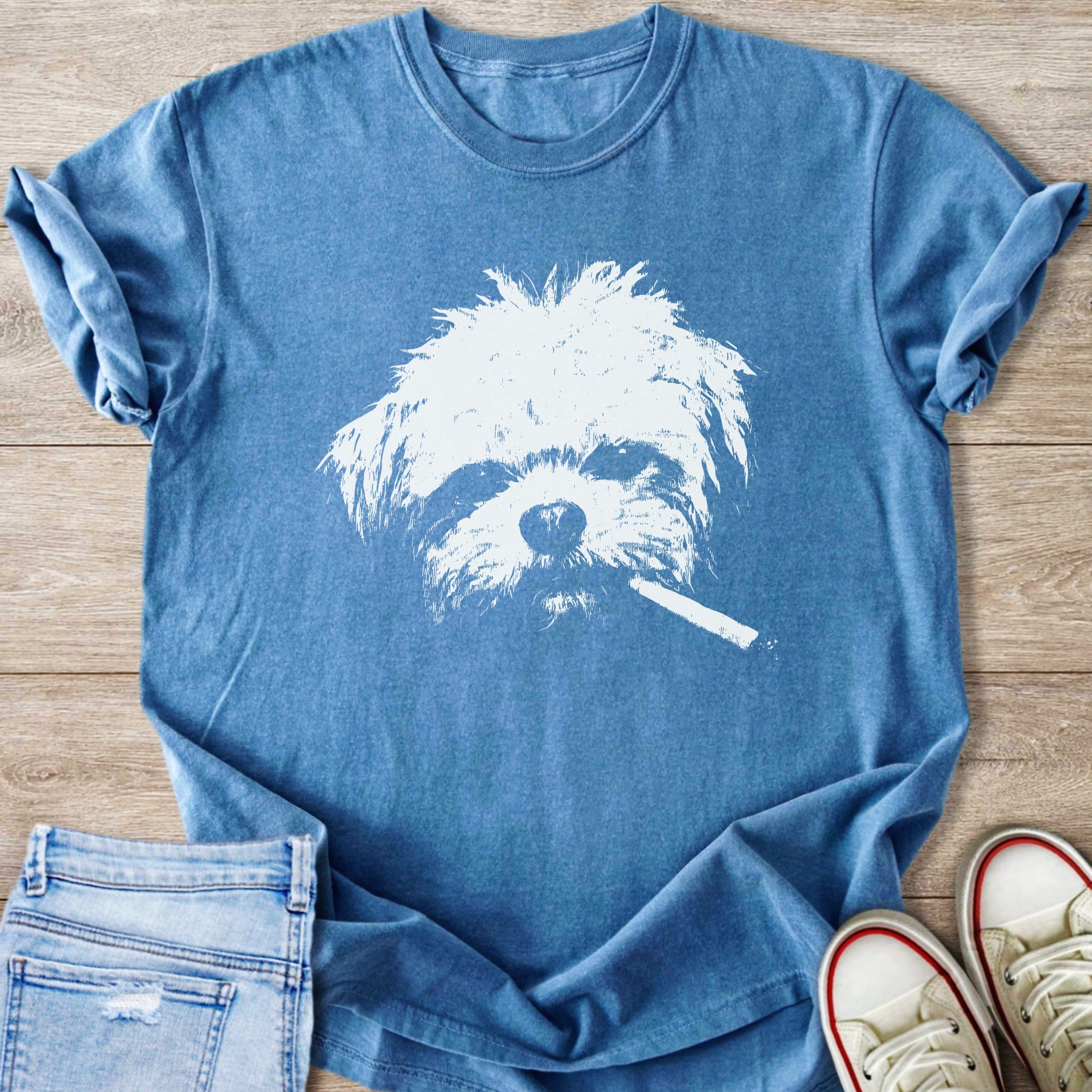 Blue t-shirt with a white stencil graphic of a dog's face holding a cigarette.