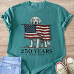 Golden Retriever holding distressed American flag; "250 YEARS 1776-2026" text.