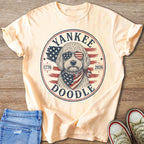 Light peach t-shirt with a circle graphic of a doodle wearing sunglasses and bandana.