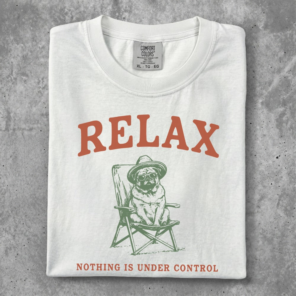 White t-shirt with pug in a chair wearing sunglasses and hat, text "RELAX" and "NOTHING IS UNDER CONTROL".