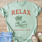 Mint green t-shirt with rust text "RELAX" and French bulldog in cowboy hat.