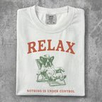 White t-shirt with "RELAX" and a dog in a lounge chair.