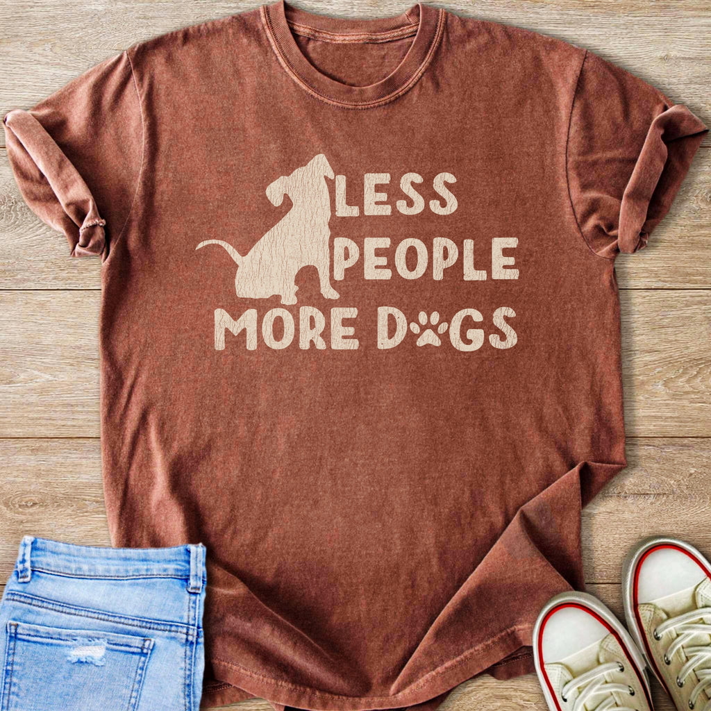 Rust colored t-shirt with dog silhouette and text "LESS PEOPLE MORE DOGS".