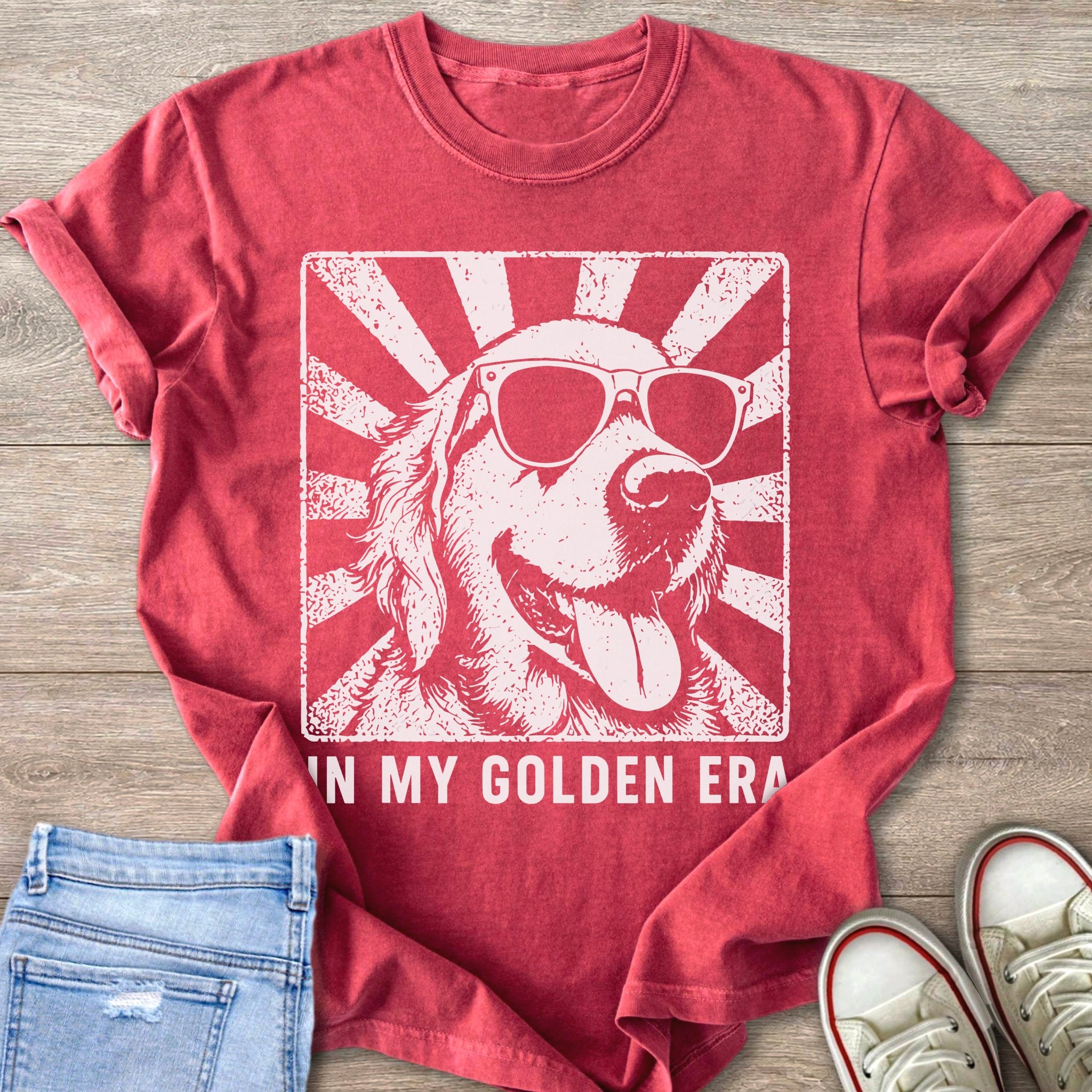 Golden Retriever dog wearing sunglasses with text "IN MY GOLDEN ERA" on shirt.