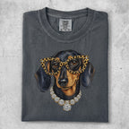 Dachshund wearing glasses and diamond necklace on charcoal t-shirt.