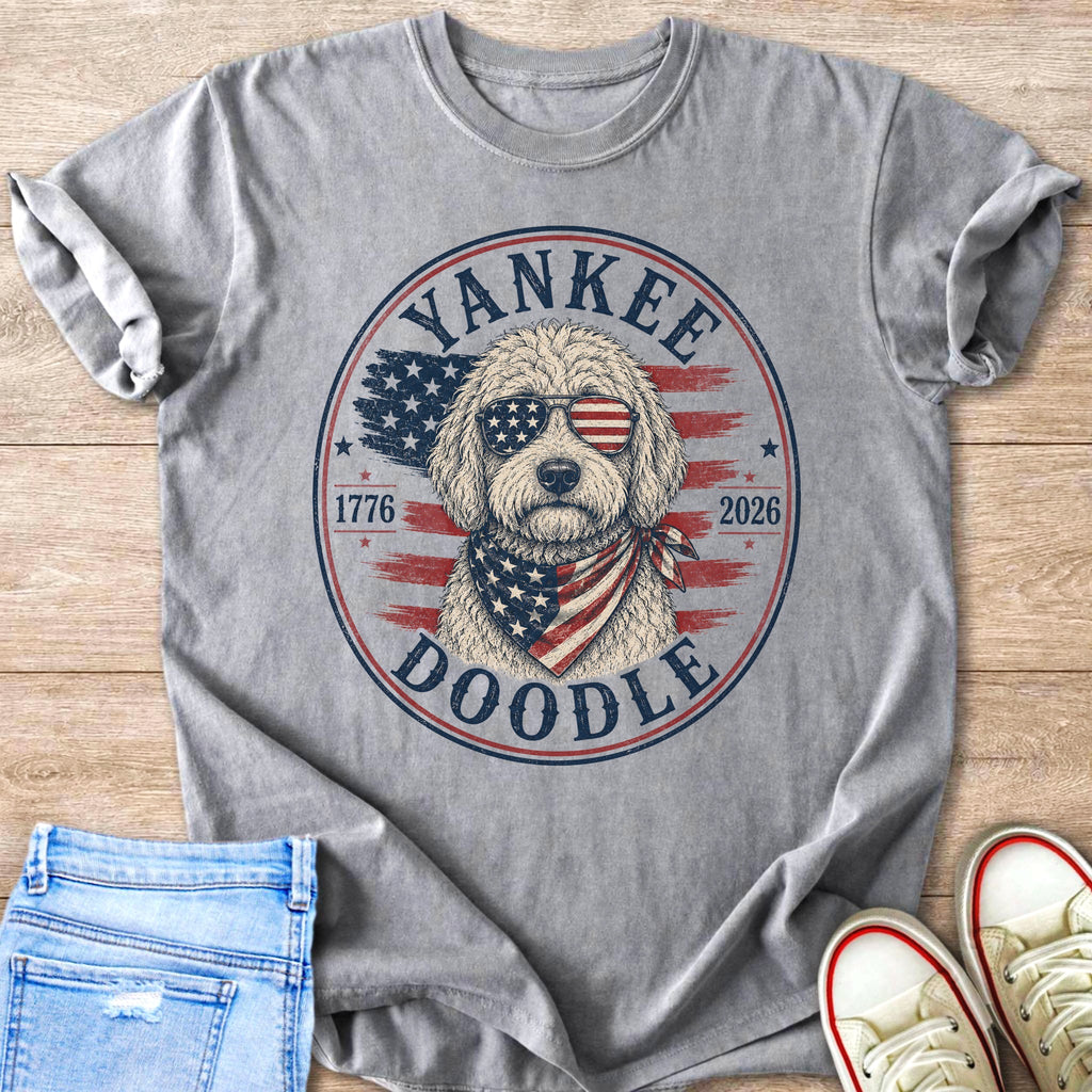 Grey t-shirt with a doodle wearing sunglasses and a bandana with a patriotic design.