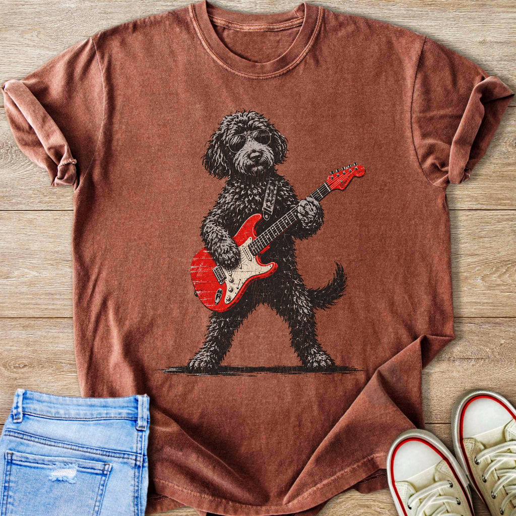 Brown t-shirt with graphic of a dog wearing sunglasses playing a red electric guitar.
