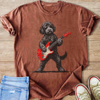 Brown t-shirt with graphic of a dog wearing sunglasses playing a red electric guitar.
