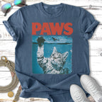 T-shirt with "PAWS" logo and a cat reaching up from underwater.