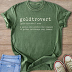 Green t-shirt with "goldtrovert noun a person who prefers the company of golden retrievers over humans" text.