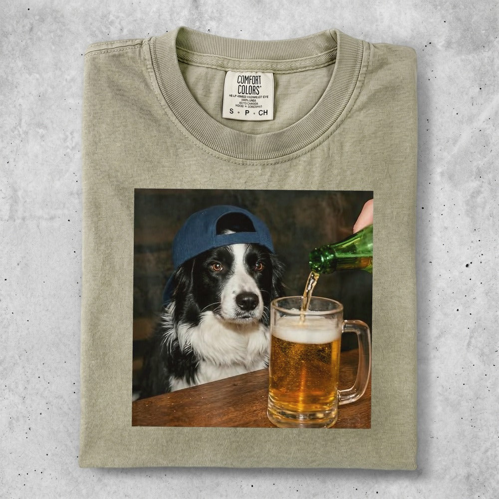 Border collie wearing a blue baseball cap looks at a beer being poured into a mug.