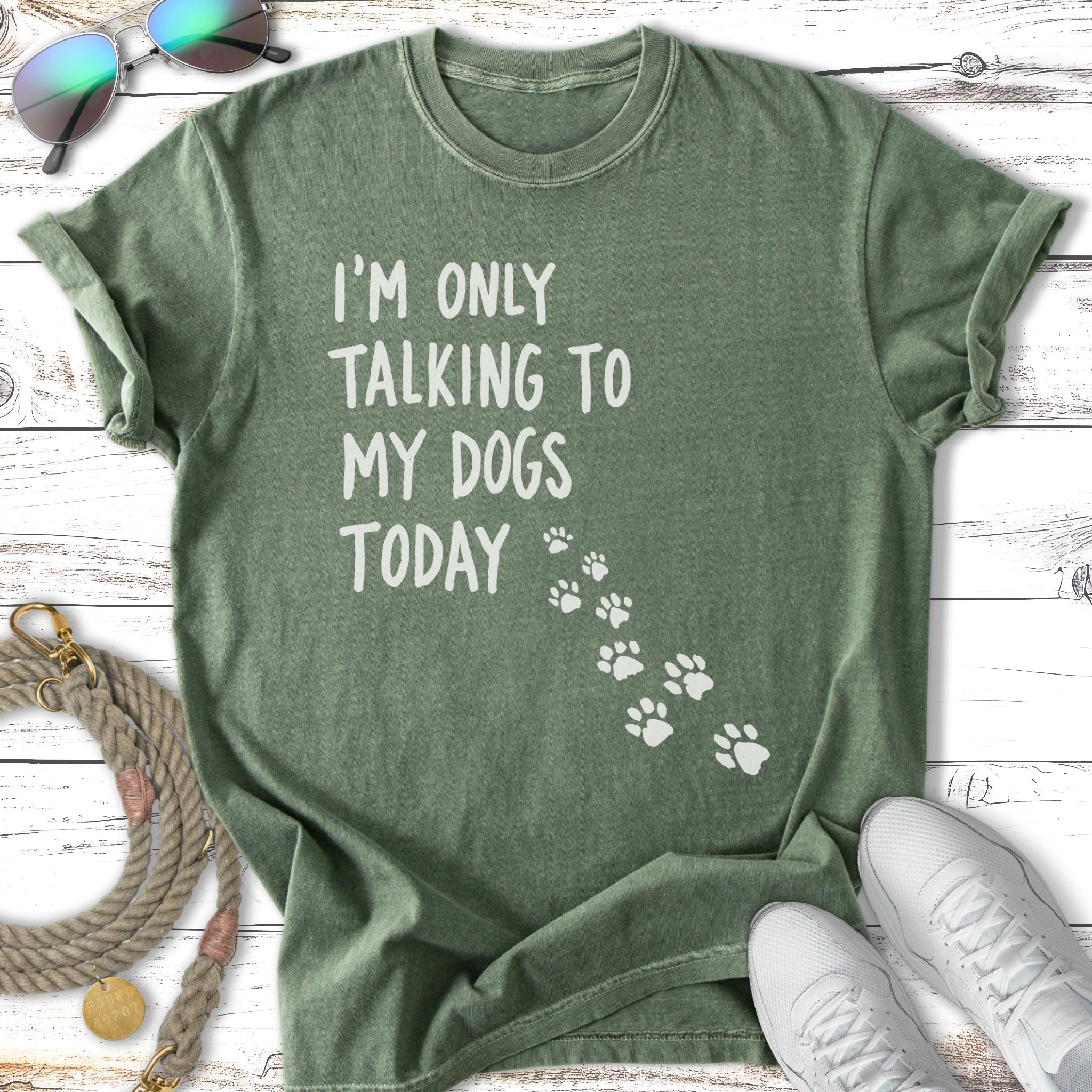 Green t-shirt with "I'm Only Talking To My Dogs Today" text and paw prints.