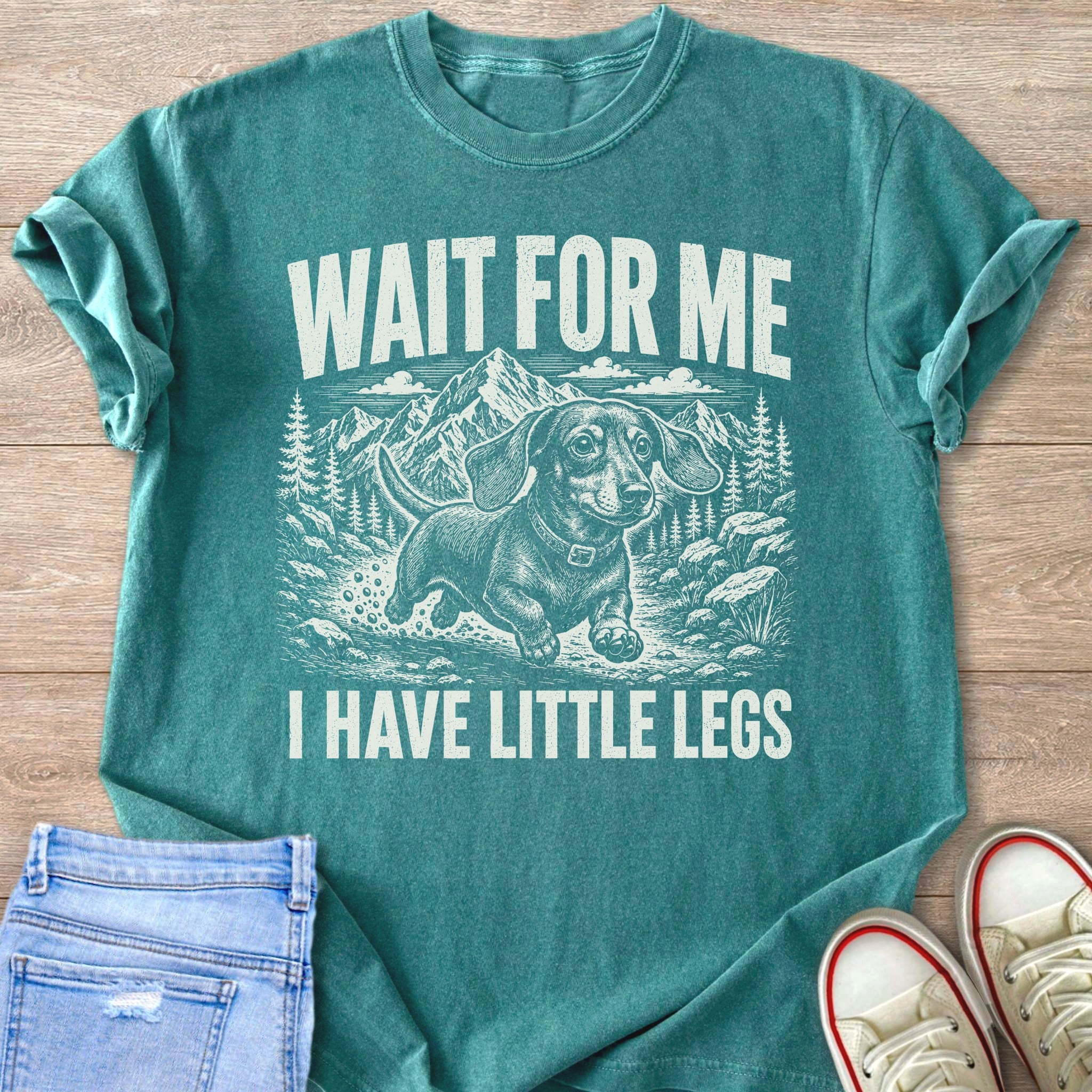 Teal t-shirt with graphic "WAIT FOR ME I HAVE LITTLE LEGS" and a dachshund.