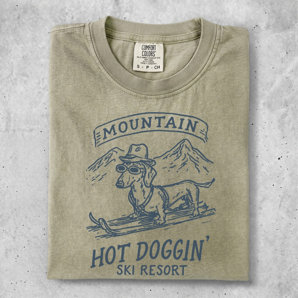 T-shirt with dachshund skiing and "Hot Doggin' Ski Resort" text.