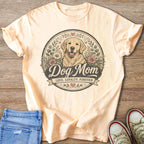 Peach t-shirt with a golden retriever illustration and text "Dog Mom".