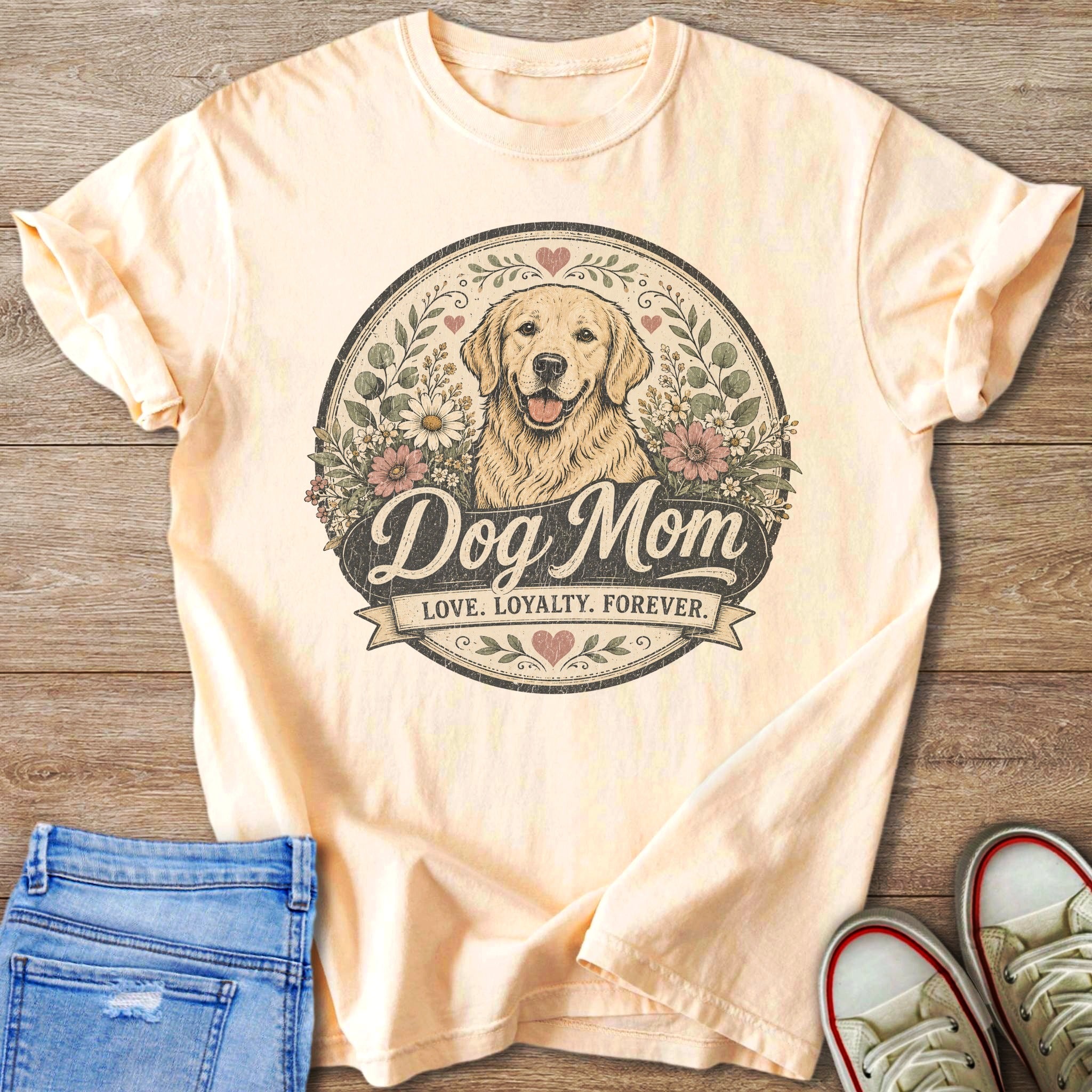 Peach t-shirt with a golden retriever illustration and text "Dog Mom".