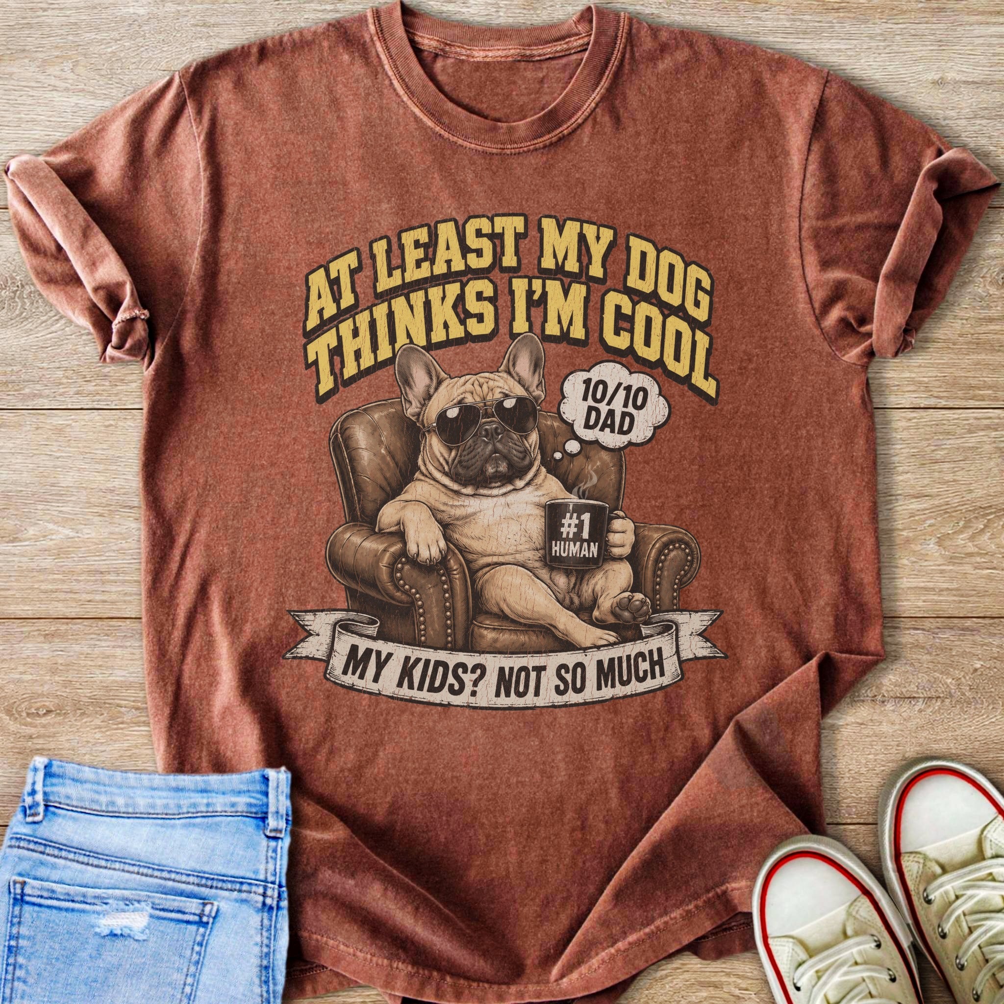French Bulldog on chair, sunglasses, mug, text "At least my dog thinks I'm cool".