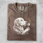 Golden retriever with dandelions on a brown Comfort Colors t-shirt.