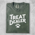 Green t-shirt with "Treat Dealer" and a paw print graphic.