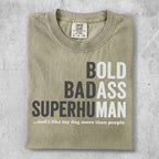 T-shirt with bold text "BOLD BADASS SUPERHUMAN" and smaller text.