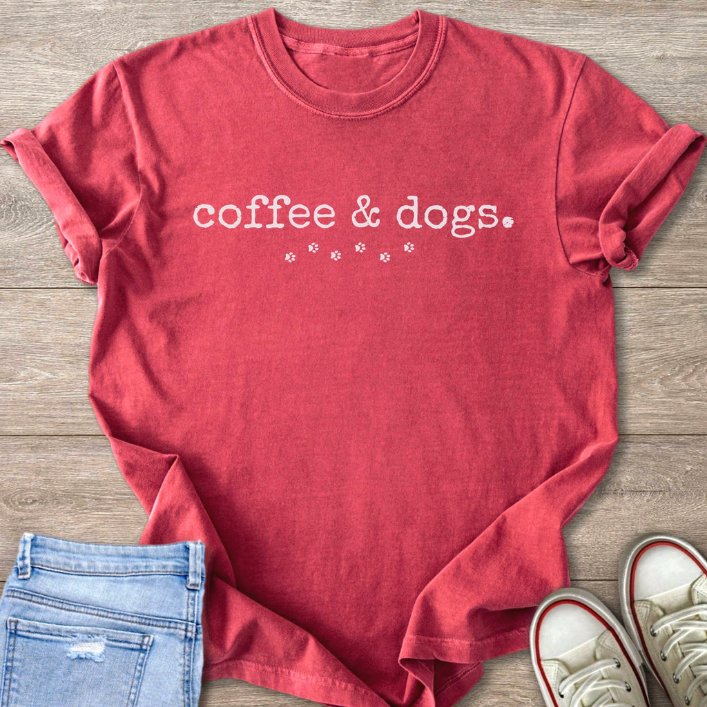 Red t-shirt with "coffee & dogs." text and paw print graphics.