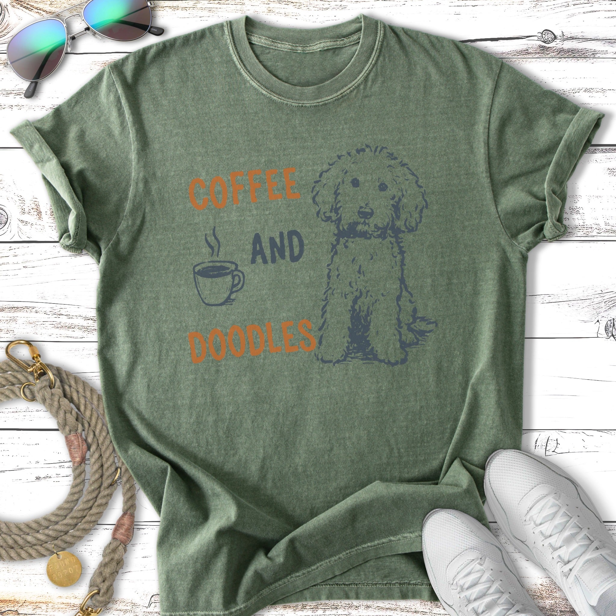 Green t-shirt with "Coffee and Doodles" text and a doodle dog graphic.