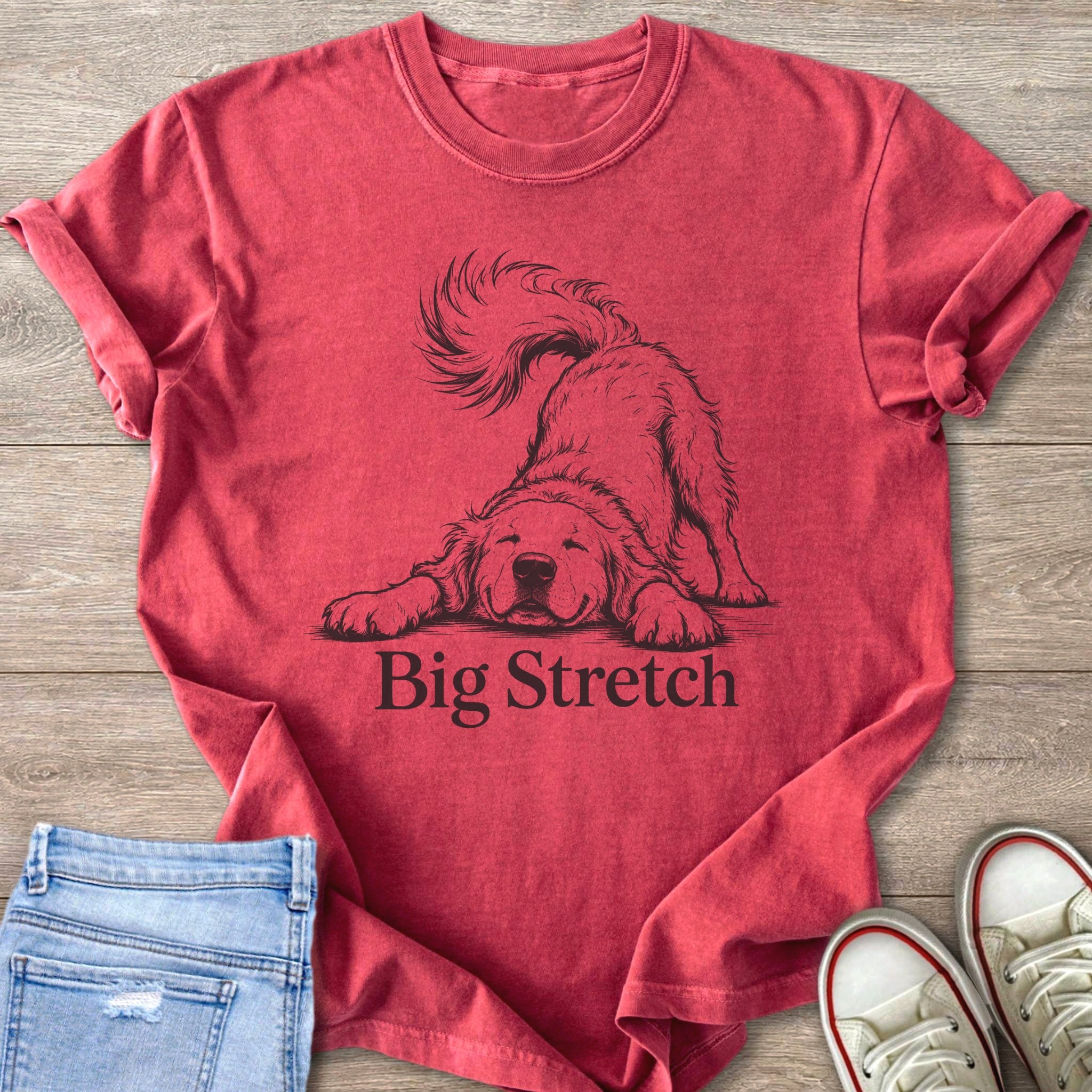 Red t-shirt with a black line drawing of a dog stretching and the text "Big Stretch."