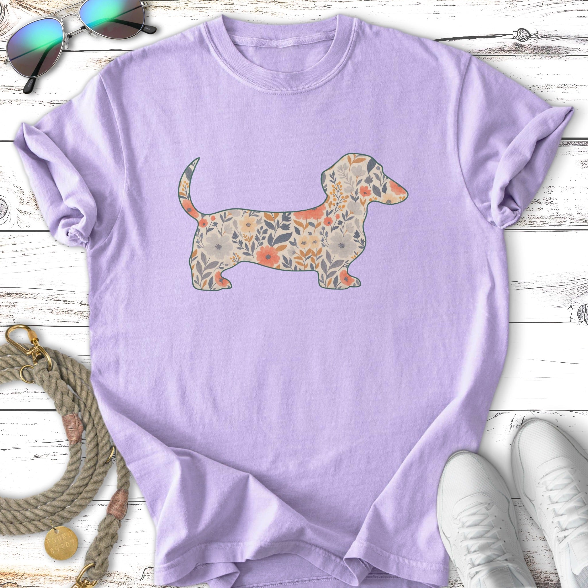 Purple t-shirt with a floral dachshund graphic.