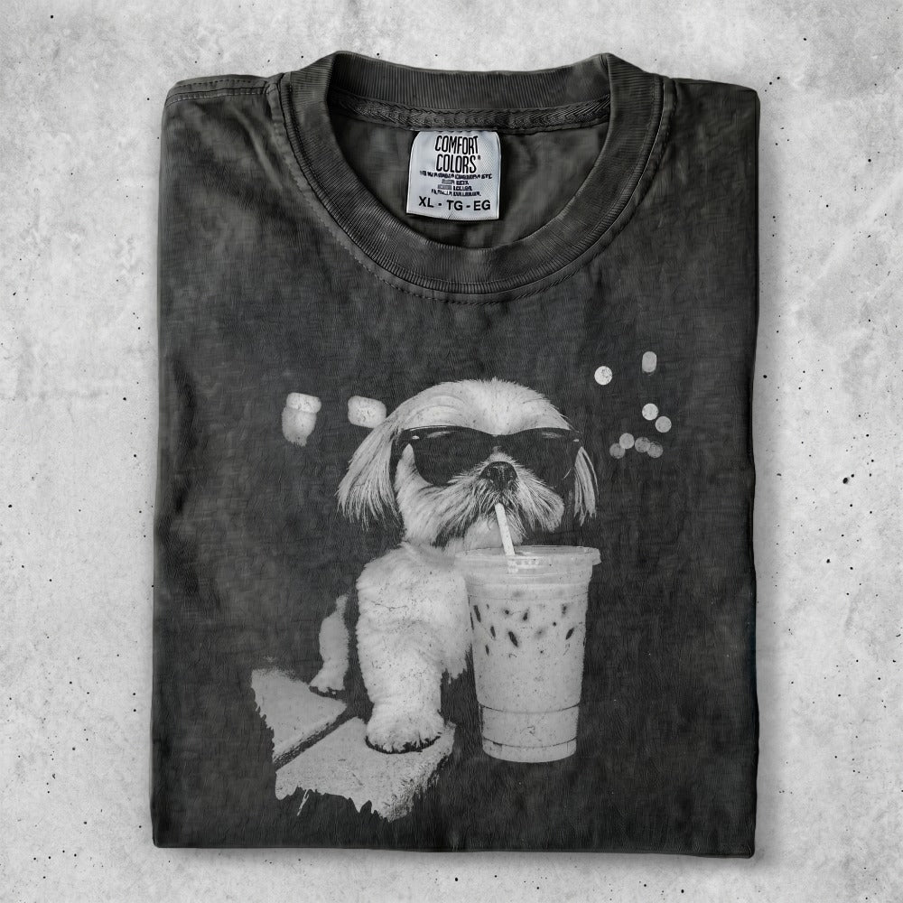 Black t-shirt with white dog wearing sunglasses and drinking a milkshake.