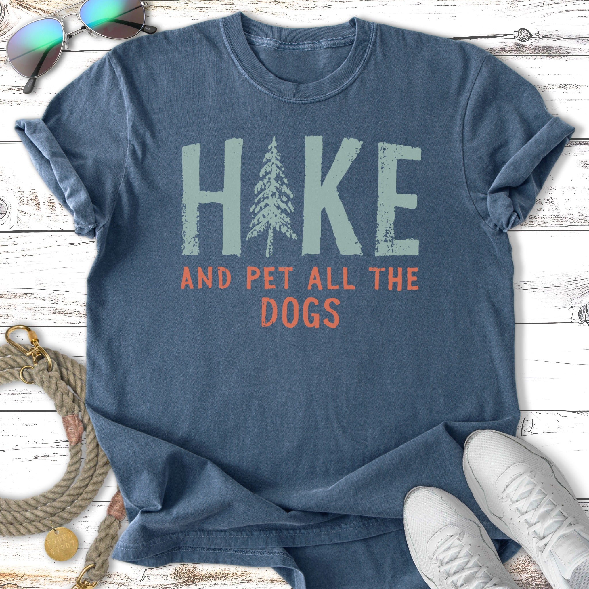T-shirt with "Hike and Pet All the Dogs" text and a pine tree graphic.