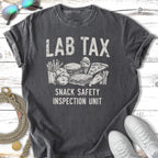 T-shirt with "Lab Tax Snack Safety Inspection Unit" text and cartoon snack illustrations.