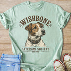 Light blue t-shirt with "WISHBONE LITERARY SOCIETY EST. 1995" and dog illustration.