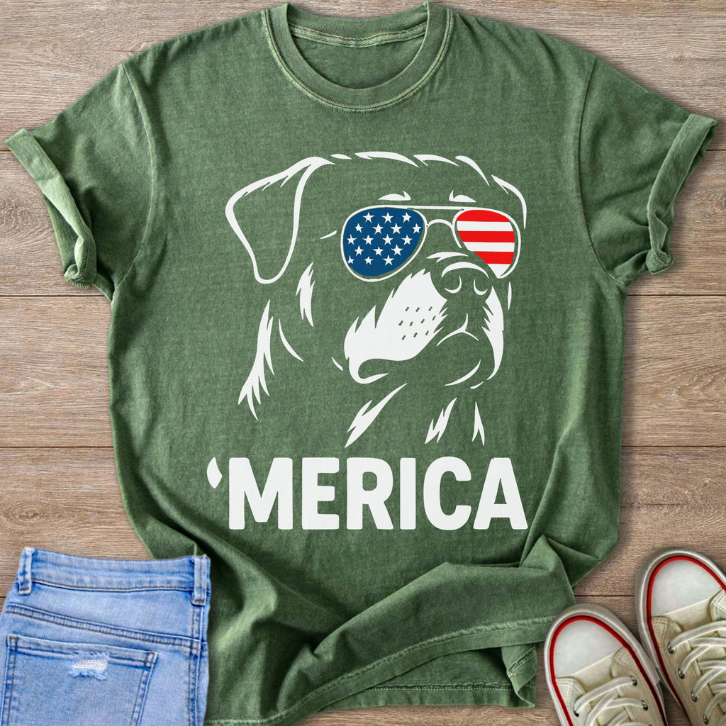 Green t-shirt with white outline of dog wearing American flag sunglasses and text 'MERICA