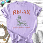 Purple t-shirt with "RELAX NOTHING IS UNDER CONTROL" text and dog illustration.