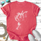 Coral t-shirt with a white terrier dog graphic and sunglasses.