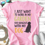 Pink t-shirt with black dog and text "I JUST WANT TO WORK IN MY GARDEN AND HANGOUT WITH MY DOG".