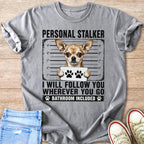 Gray t-shirt with a chihuahua graphic and text reading "PERSONAL STALKER I WILL FOLLOW YOU WHEREVER YOU GO BATHROOM INCLUDED".
