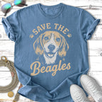 Beagle dog graphic on a blue t-shirt, "Save the Beagles" text.