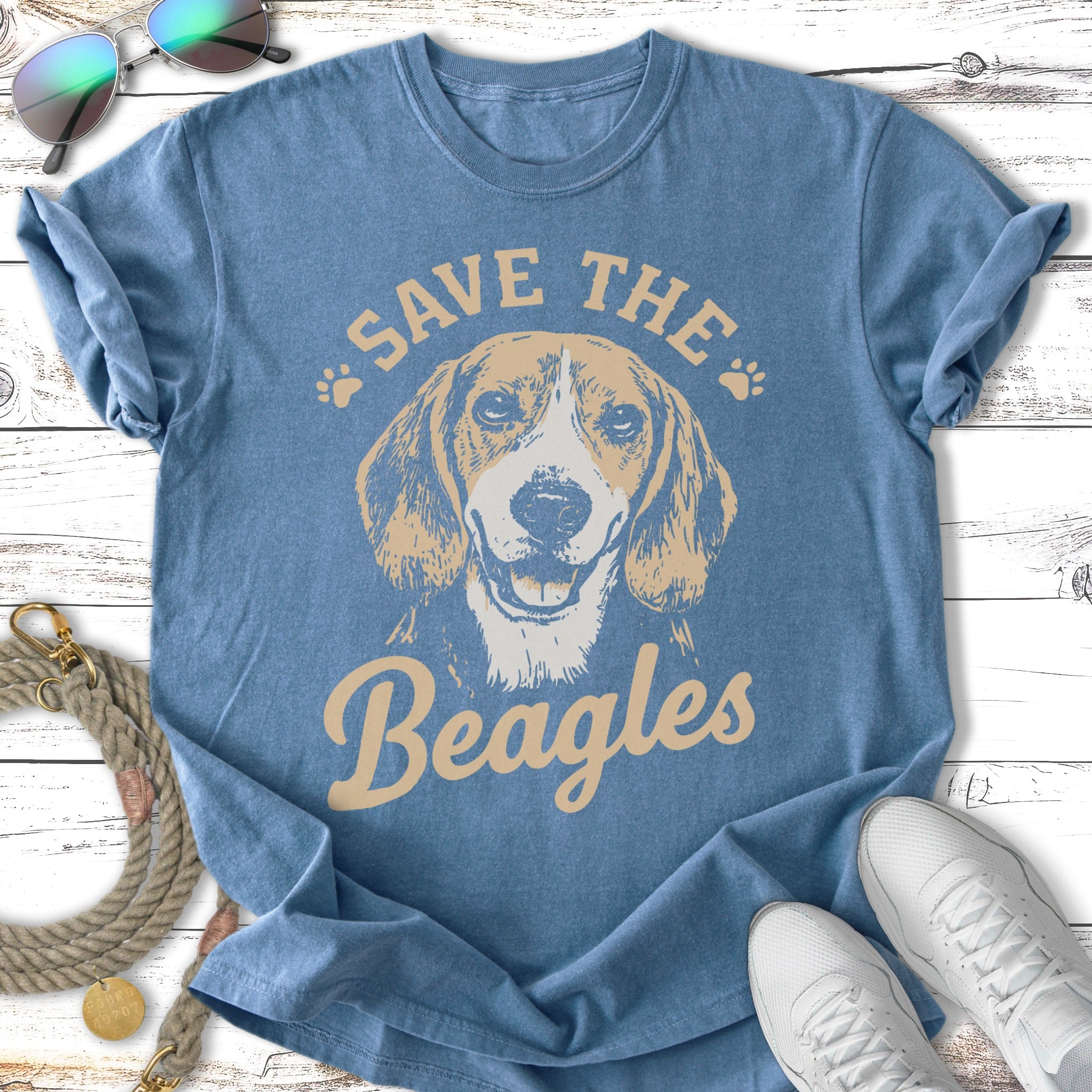 Beagle dog graphic on a blue t-shirt, "Save the Beagles" text.