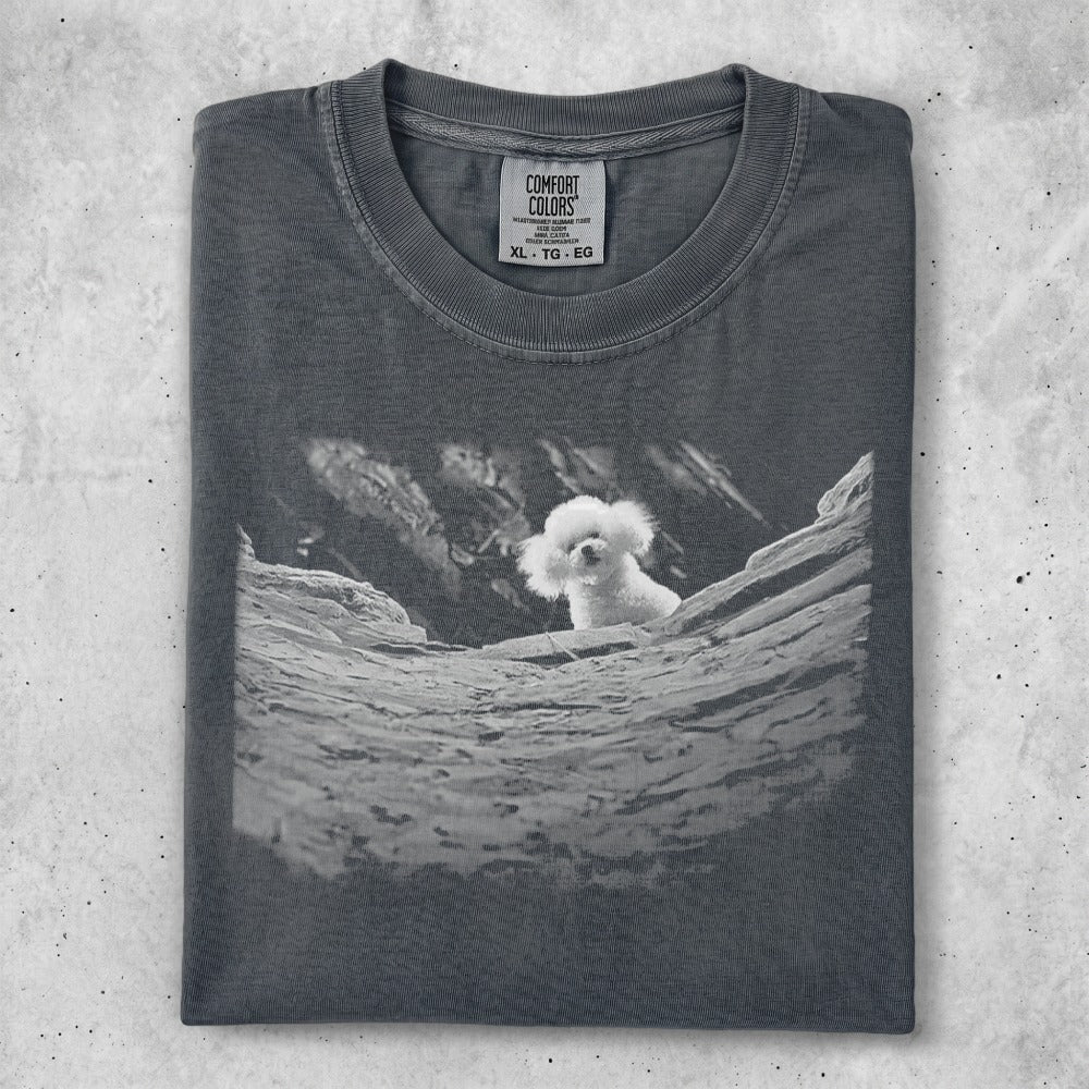 Dark gray t-shirt with white poodle peeking from behind rocks graphic.