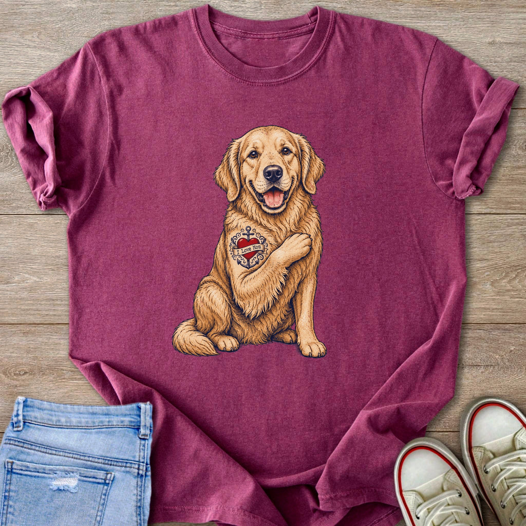Golden retriever with "I Love Mom" heart tattoo on chest, on burgundy t-shirt.