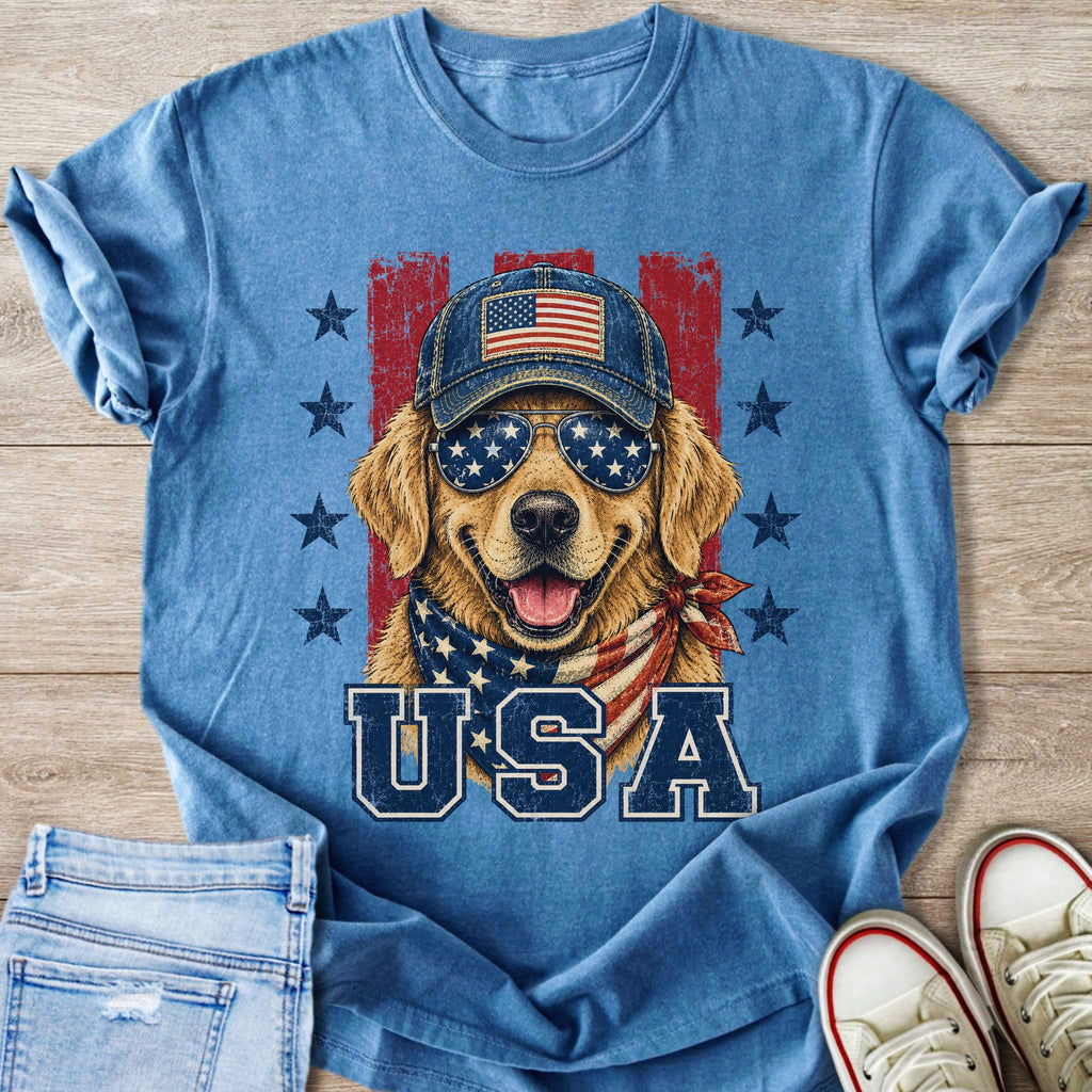 Golden retriever dog wearing patriotic sunglasses, baseball cap, and bandana with "USA" text.