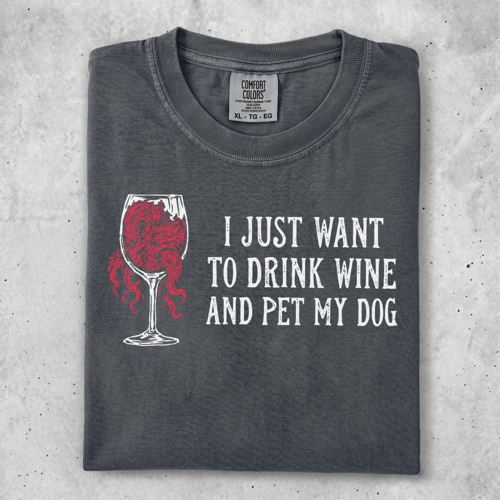 Charcoal t-shirt with graphic of wine glass and text "I JUST WANT TO DRINK WINE AND PET MY DOG".