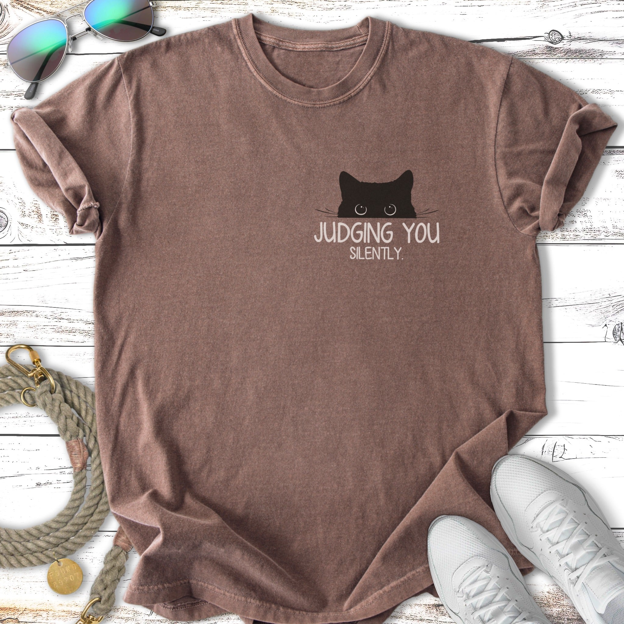 Brown t-shirt with black cat peeking and text "JUDGING YOU SILENTLY".