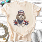 Dog wearing USA bandana, sunglasses, and hat, with patriotic accents.