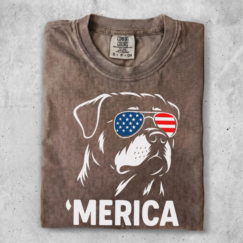 Rottweiler wearing sunglasses with American flag pattern and "MERICA" text.