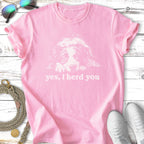 Pink t-shirt with a white outline of a dog's head and "yes, I herd you" text.