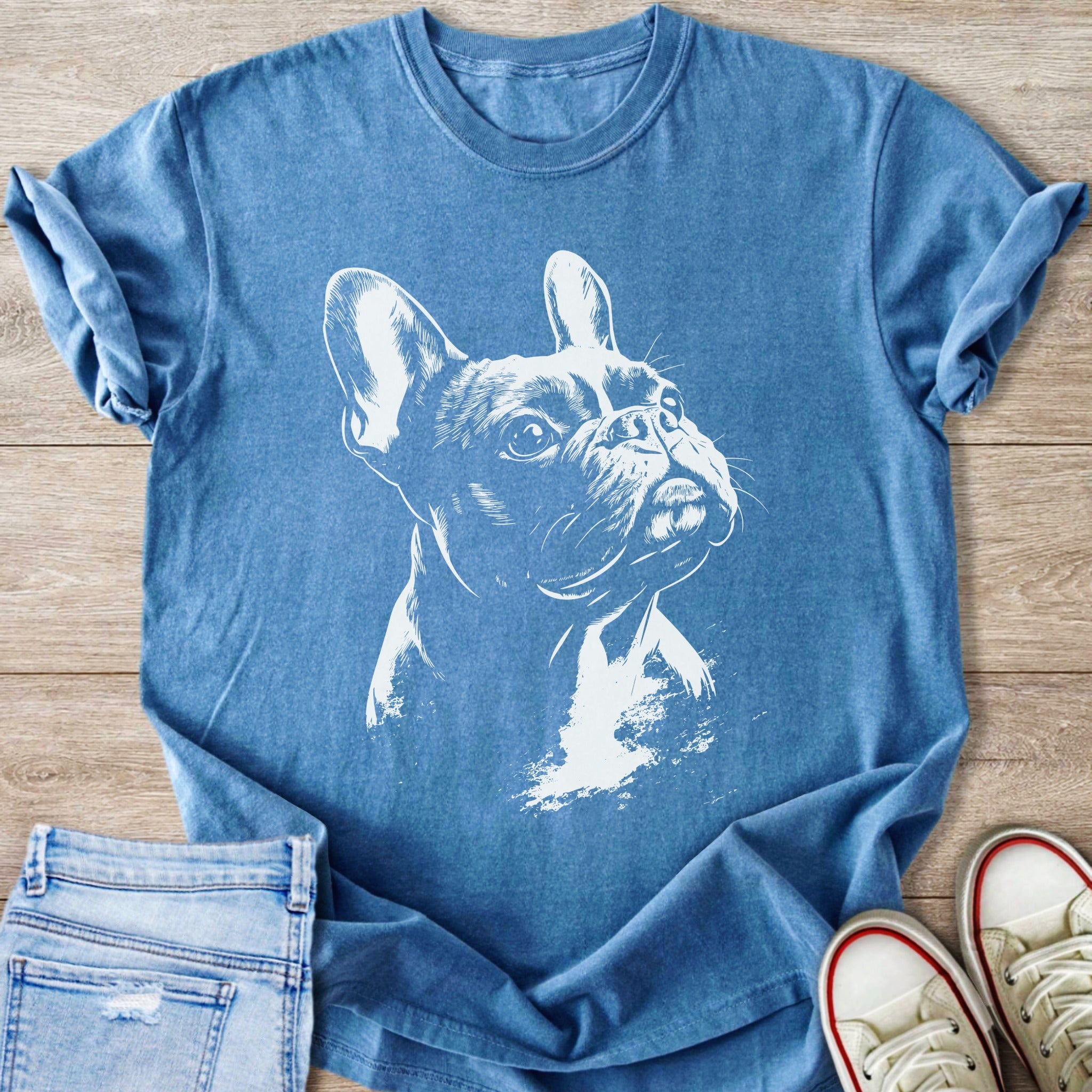 Blue t-shirt with a white sketch of a French Bulldog's head.
