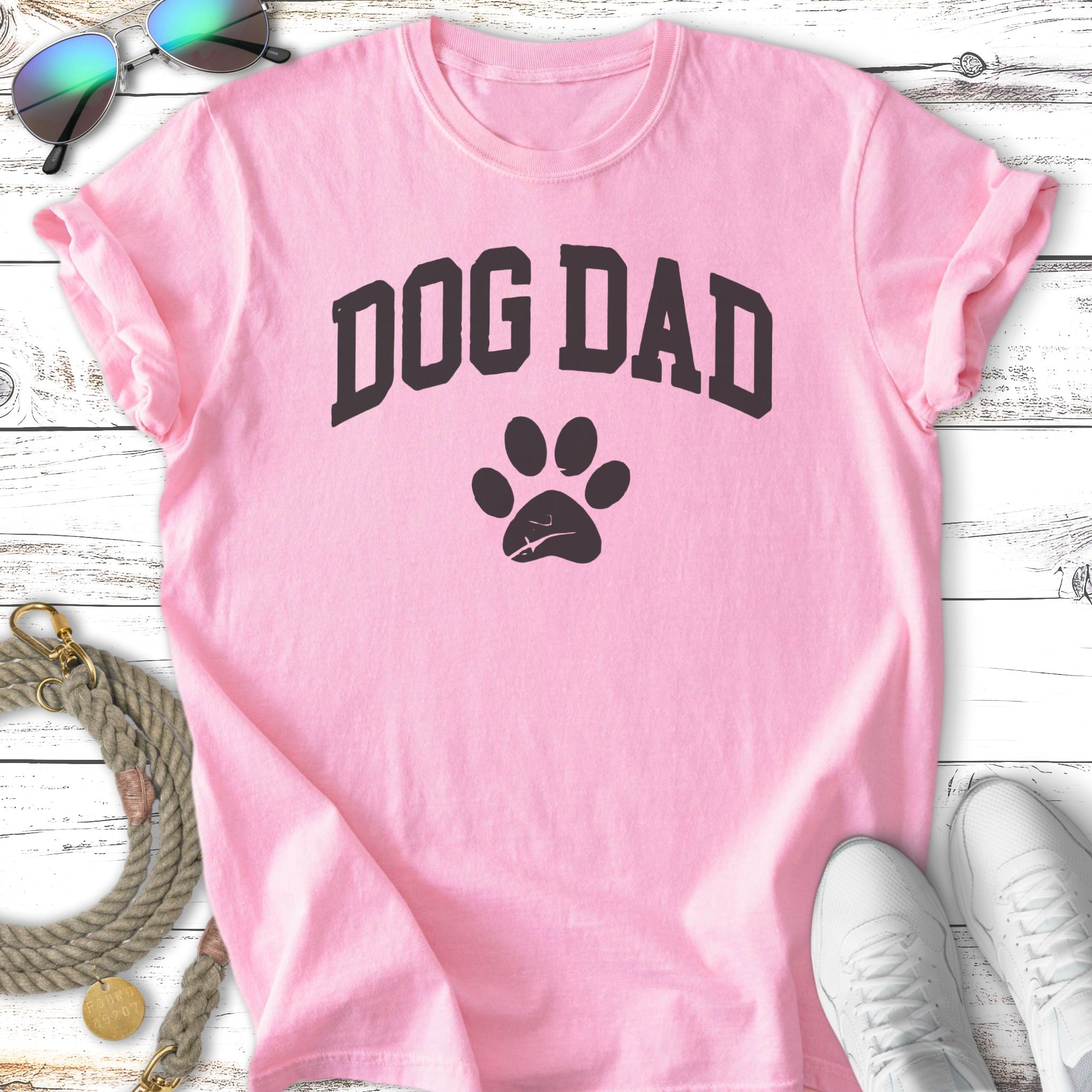 Pink t-shirt with "DOG DAD" and a paw print graphic.